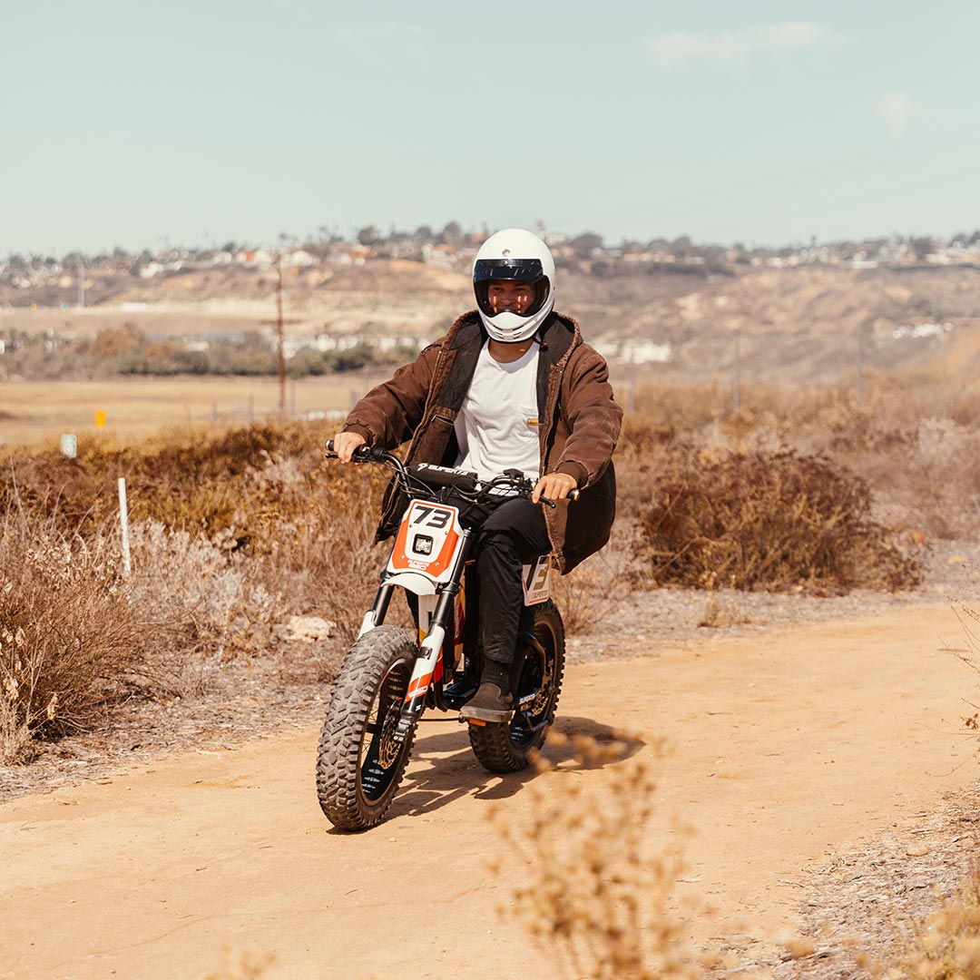 Lifestyle image of a rider on the RSD x SUPER73 RX Malibu