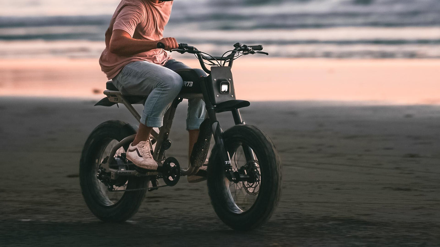 super73 electric bike that looks like a motorcycle at the beach