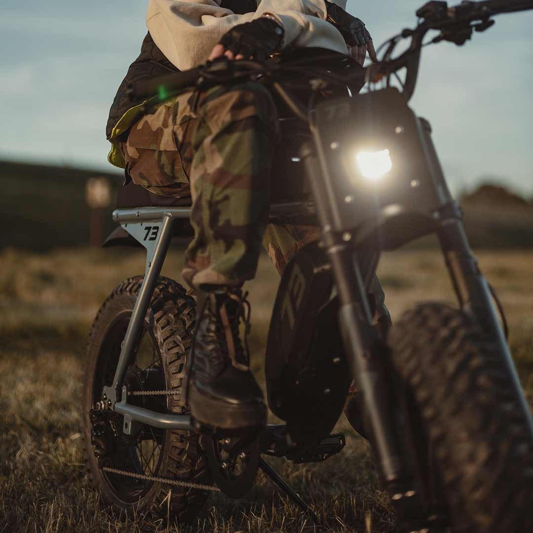 Lifestyle image of a rider hanging out on the S Adventure at sundown.