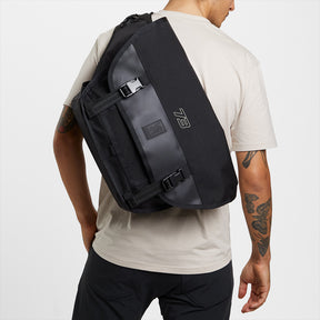 Mini Metro Messenger Bag on persons back on white background view 7