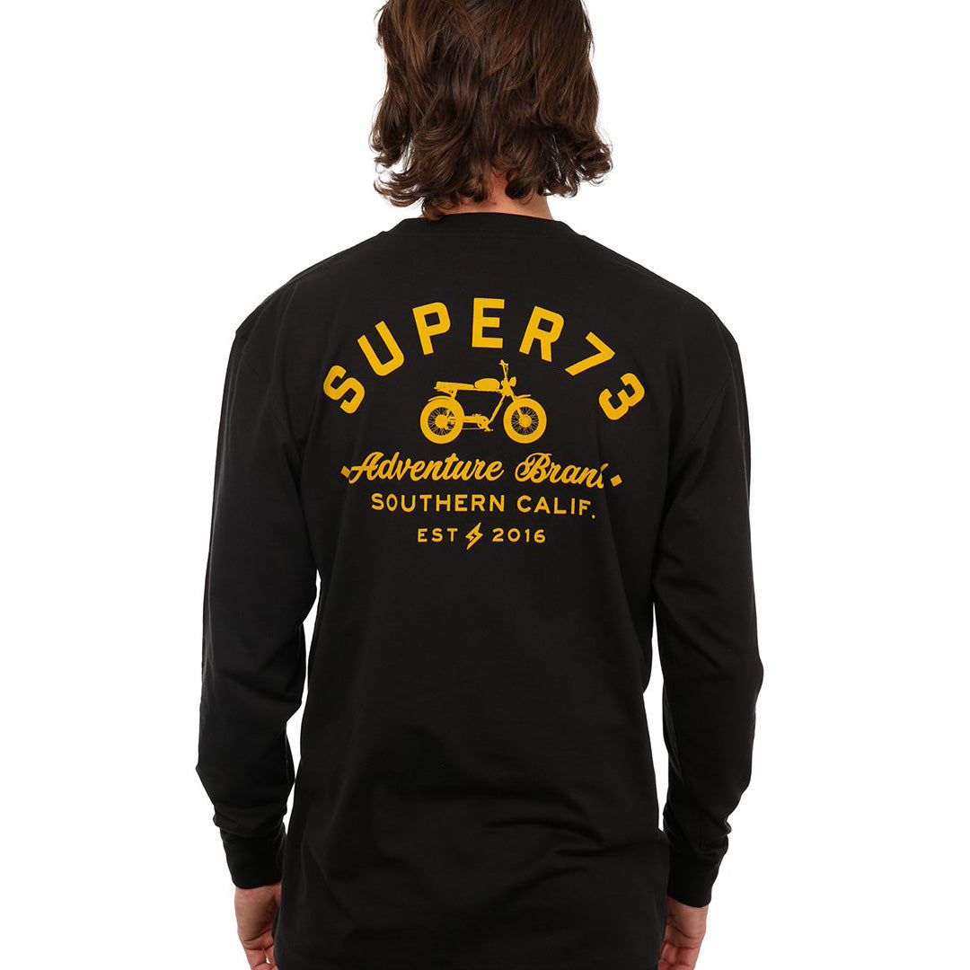 Back view of female model in Black Adventure Long Sleeve T-Shirt on white background.