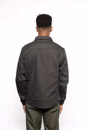 Back view of Male model wearing Anvil Chore Jacket in gravel colorway.