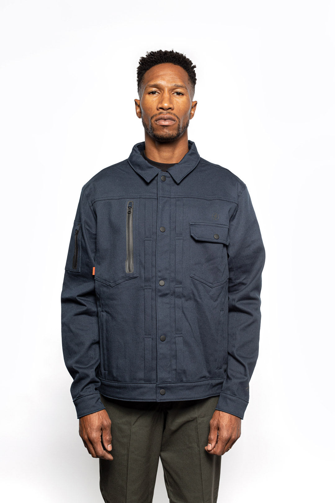 Male model wearing Anvil Chore Jacket in midnight colorway.