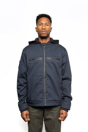 Male model wearing Chisel Hooded Jacket in midnight colorway.