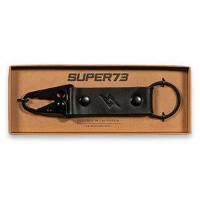 Top view of Super73 leather keychain in box.