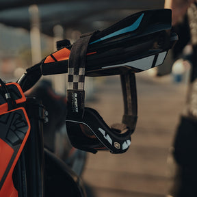 100% x Super73 Barstow Goggle hanging on bike handle.