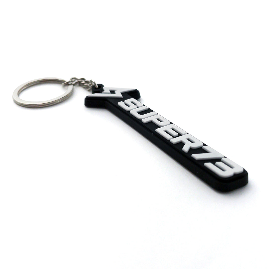 Side angle view of Super73 logo keychain.