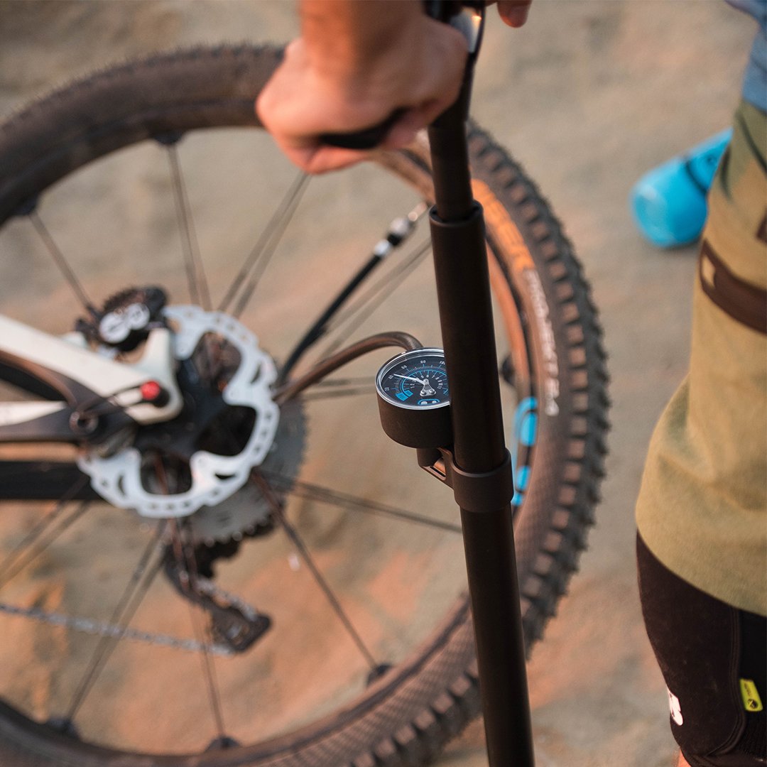 Crankbrothers Sapphire Floor Pump inflating tire.