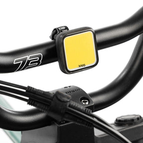 Skull light mounted on bike with white background