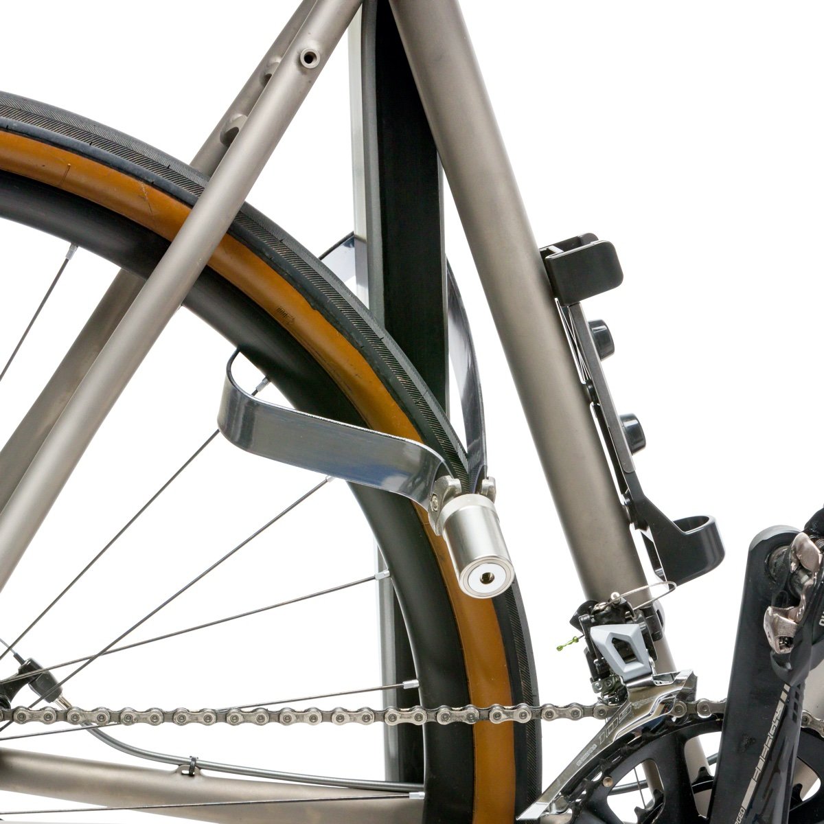 Close up view of TiGr BLUE Mini lock fixed to bike wheel on white background.