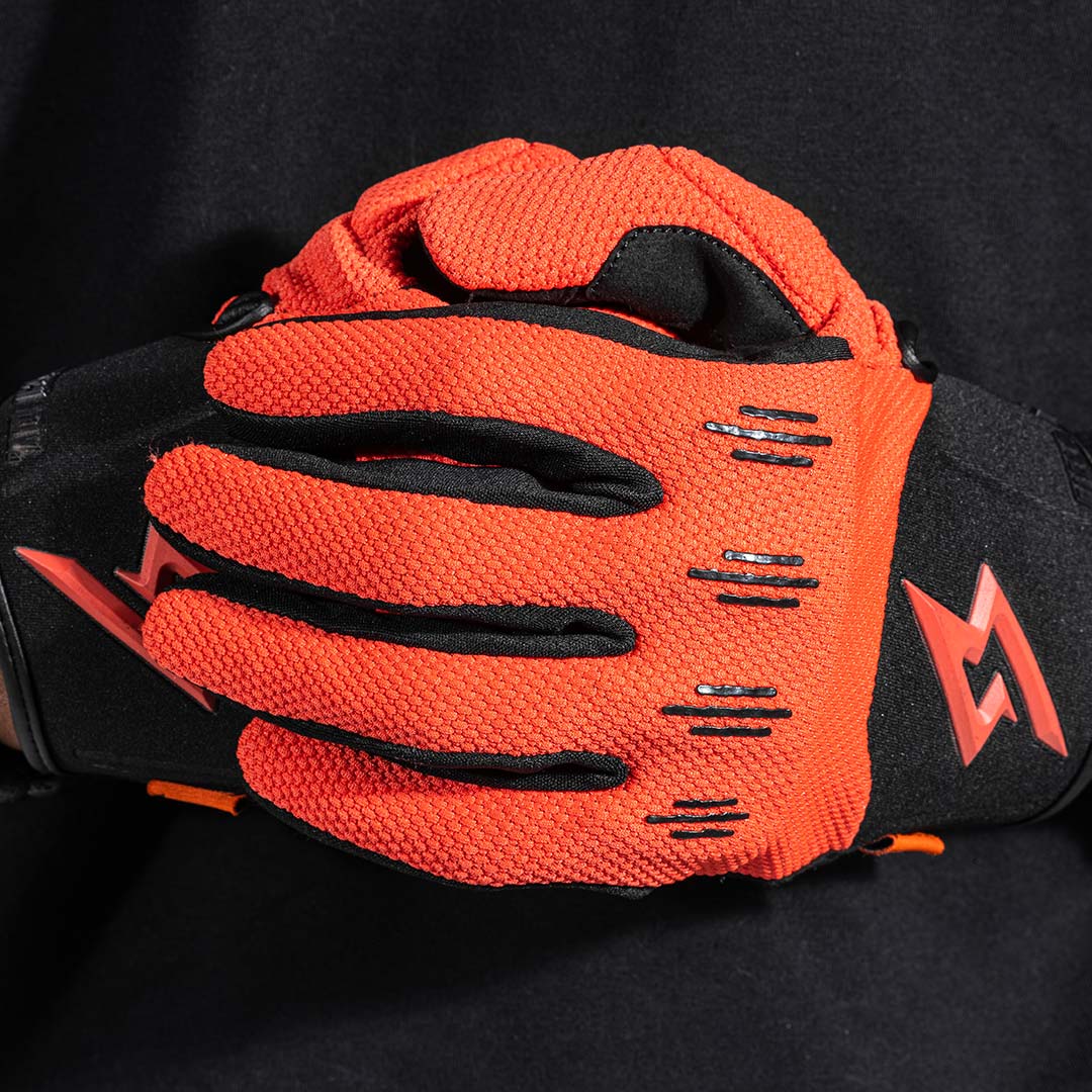Orange glove on black background view 3