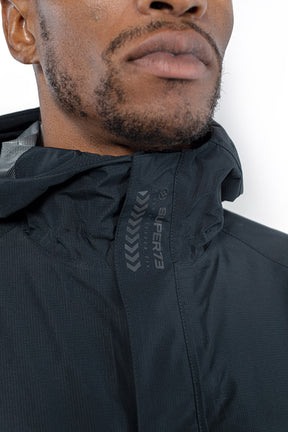 Detail view of Male model wearing Vale Packable Anorak in black colorway.